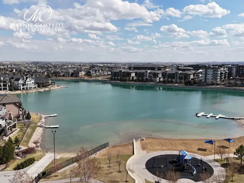 Aerial view of Mahogany Lake in Calgary with beachfront and walking paths